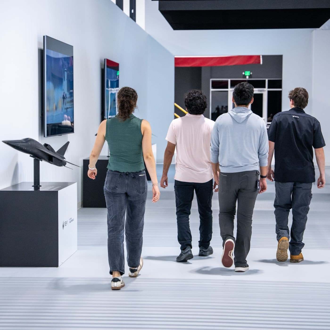 Interns walking the XB-1 gallery at Boom headquarters