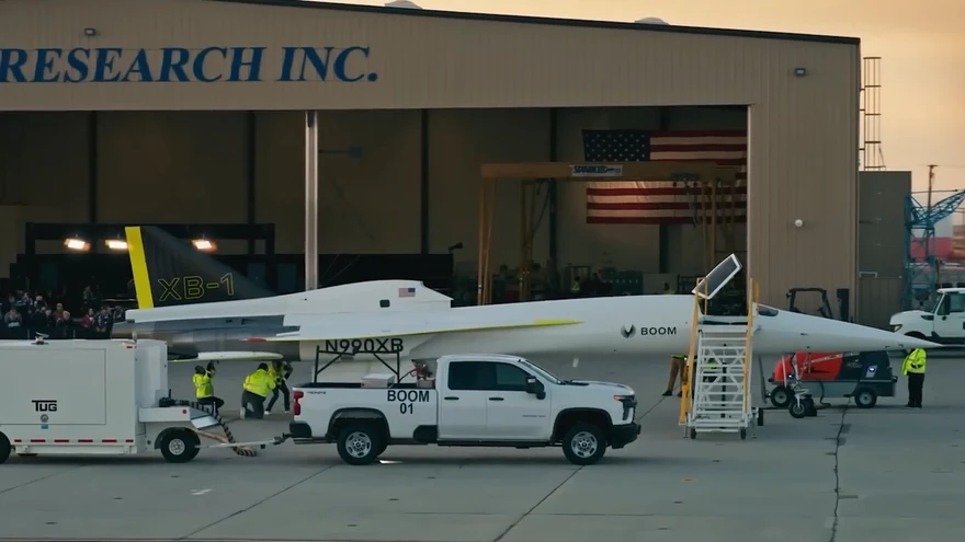 XB-1 towed out of its hangar by a pickup truck