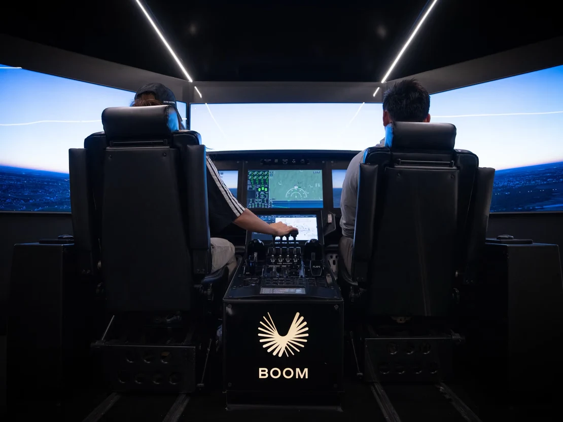 Pilots in the Boom flight simulator