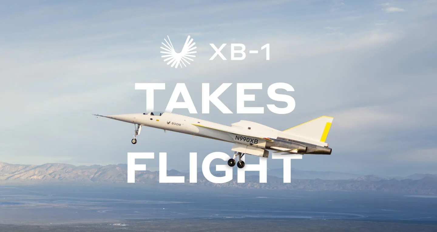 XB-1 with its landing gear extended above the desert, over the words “XB-1 takes flight”