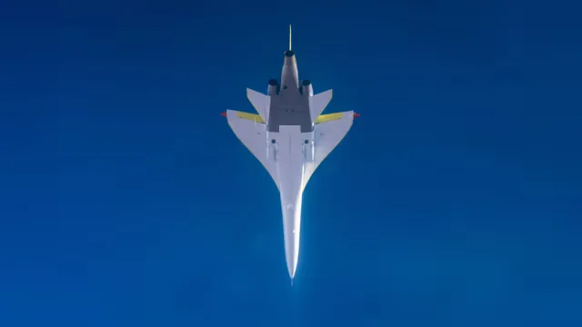 XB-1 seen from below against a deep blue sky