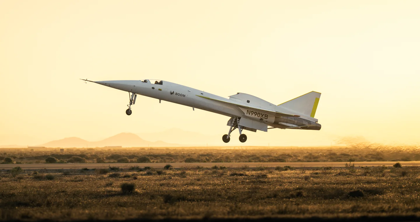 XB-1 lifting off over the desert in golden evening light