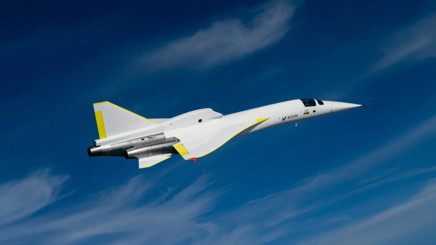 XB-1 climbing against a blue sky, seen from above its left side