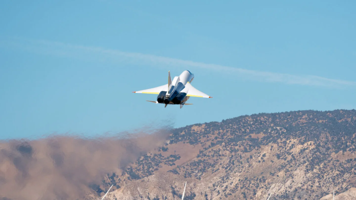 XB-1 climbing above the desert, seen from behind