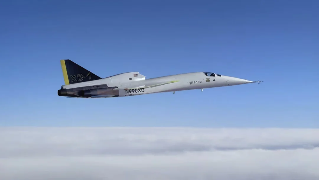XB-1 in flight above a layer of cloud
